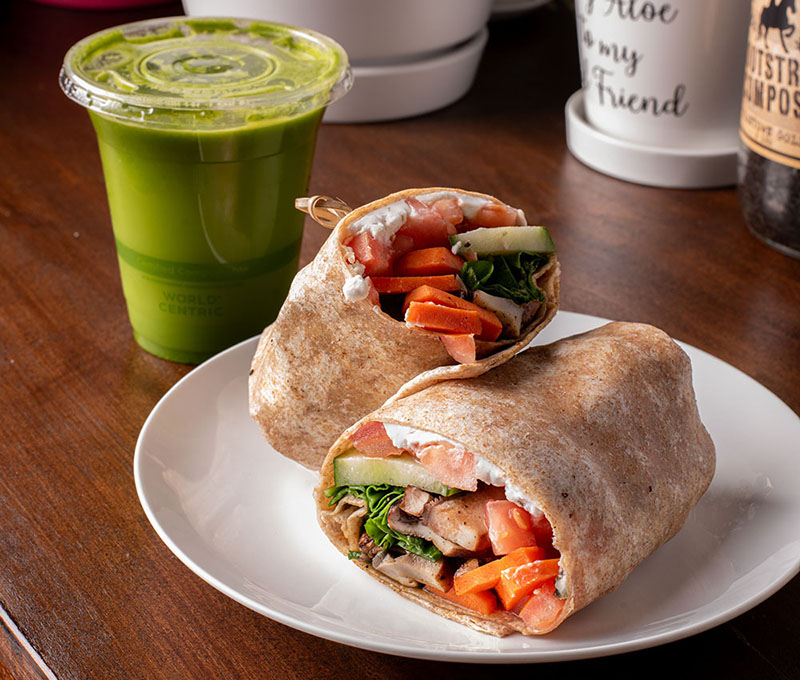 Smoothies and wrap on plate