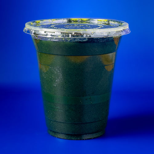 dark green colored juice with bursts of yellow